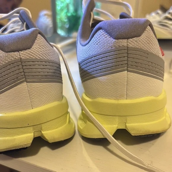 On Running Light Gray and Soft Yellow Shoes